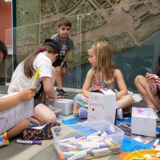 A group of students participating in an art activity. 